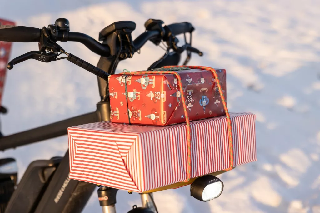 a bicycle with a bunch of christmas presents on the back festive 500